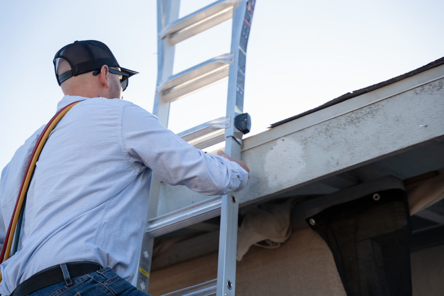 HVAC working on ladder