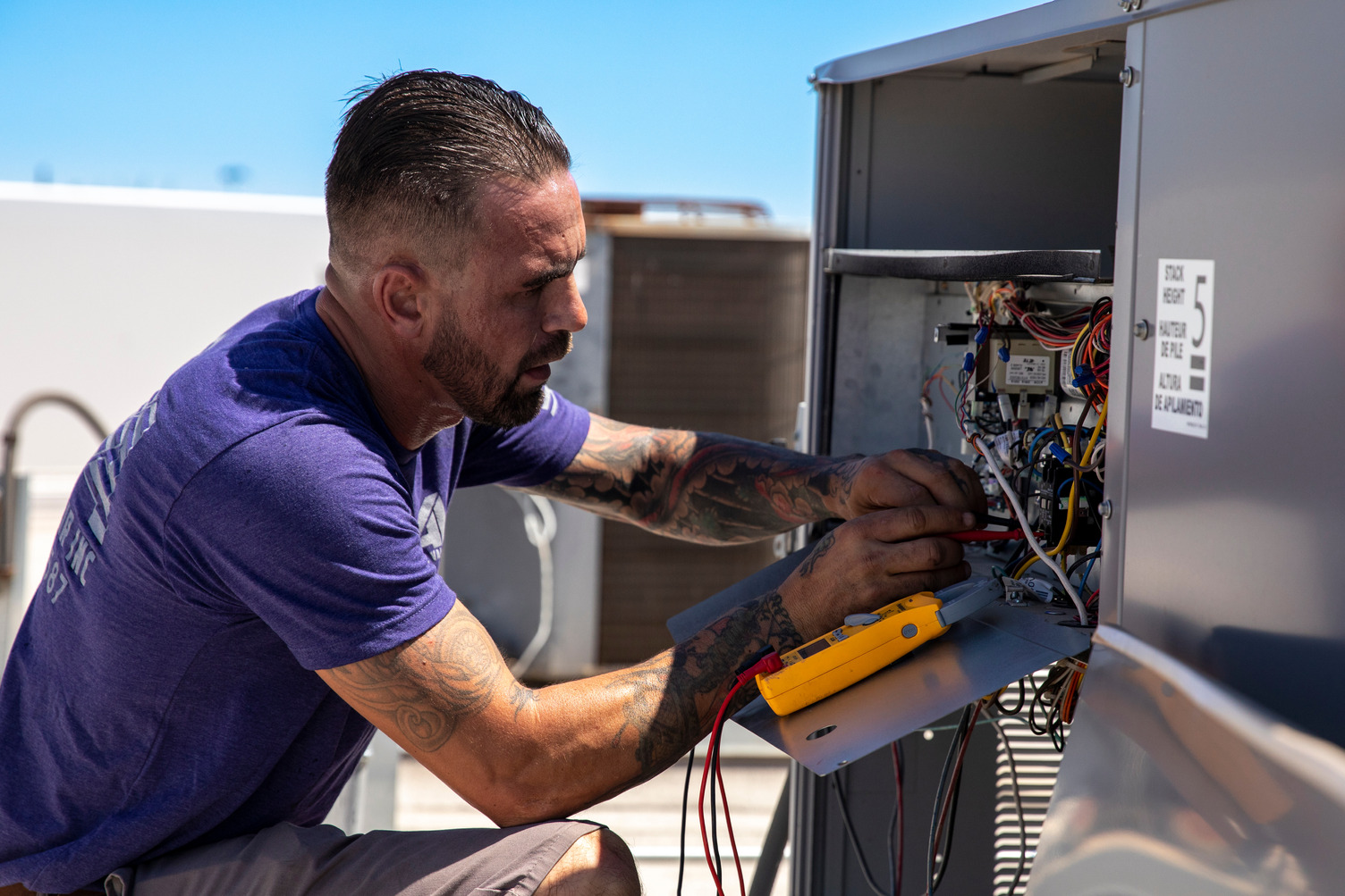 HVAC technician on roof