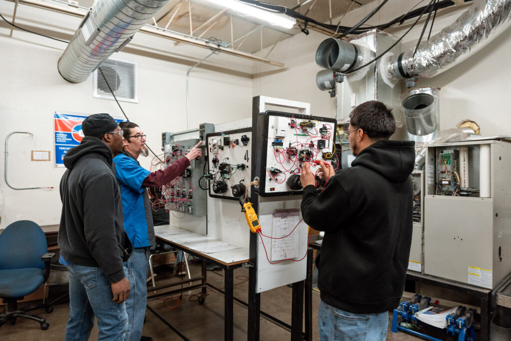 Group of students learning about HVAC at RSI