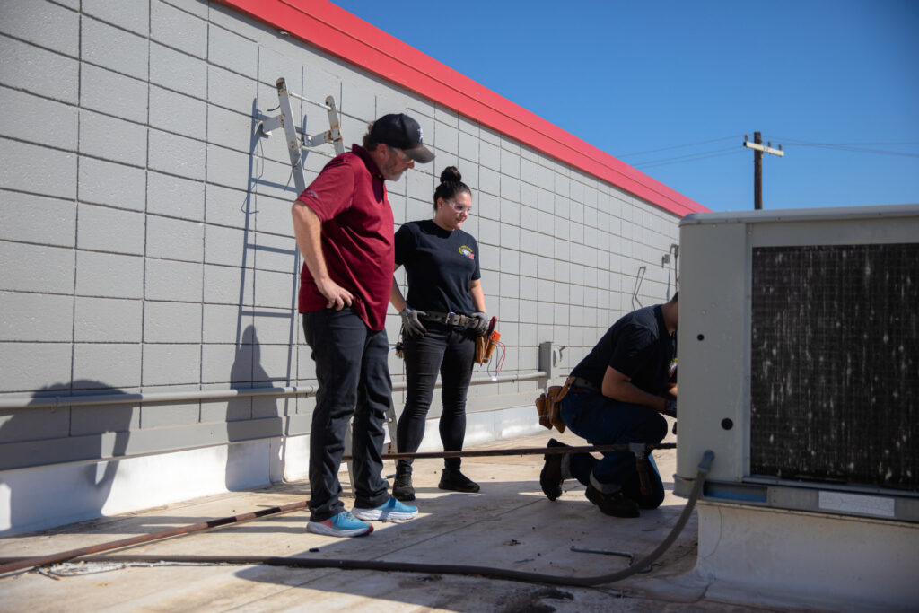 TWS students installing hvac equipment