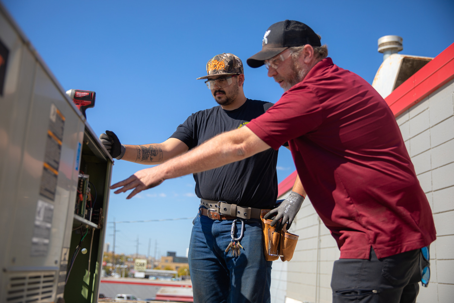 HVAC technicians at TWS working on a rooftop