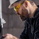 electrician working on electrical box setup