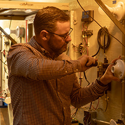 electrician working on panel