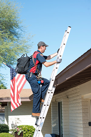 hvac business owner climbing ladder