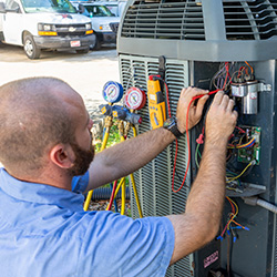 hvac technician fixing ac