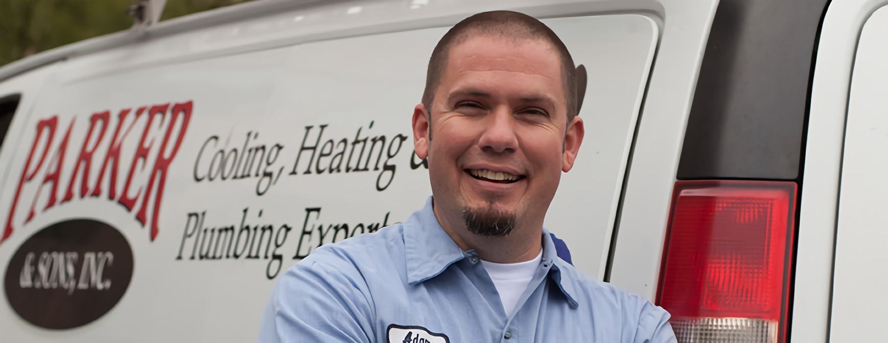 hvac technician in front of van