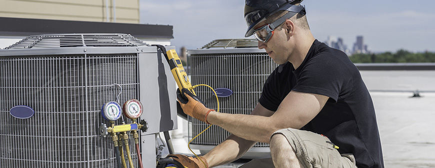 hvac worker on roof