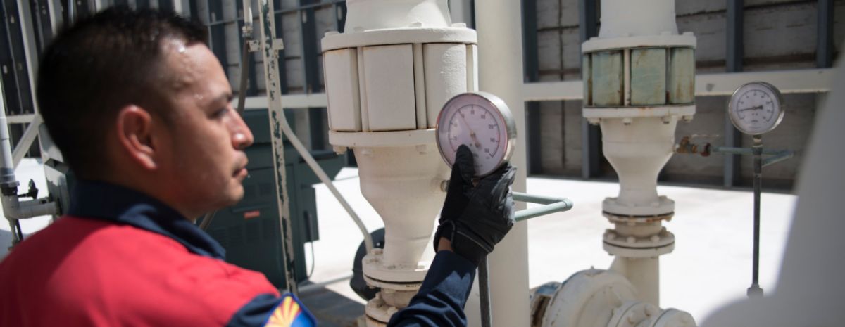 industrial hvac tech checking guages