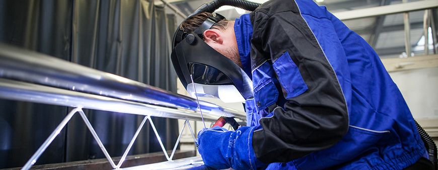 industrial welder working on structure